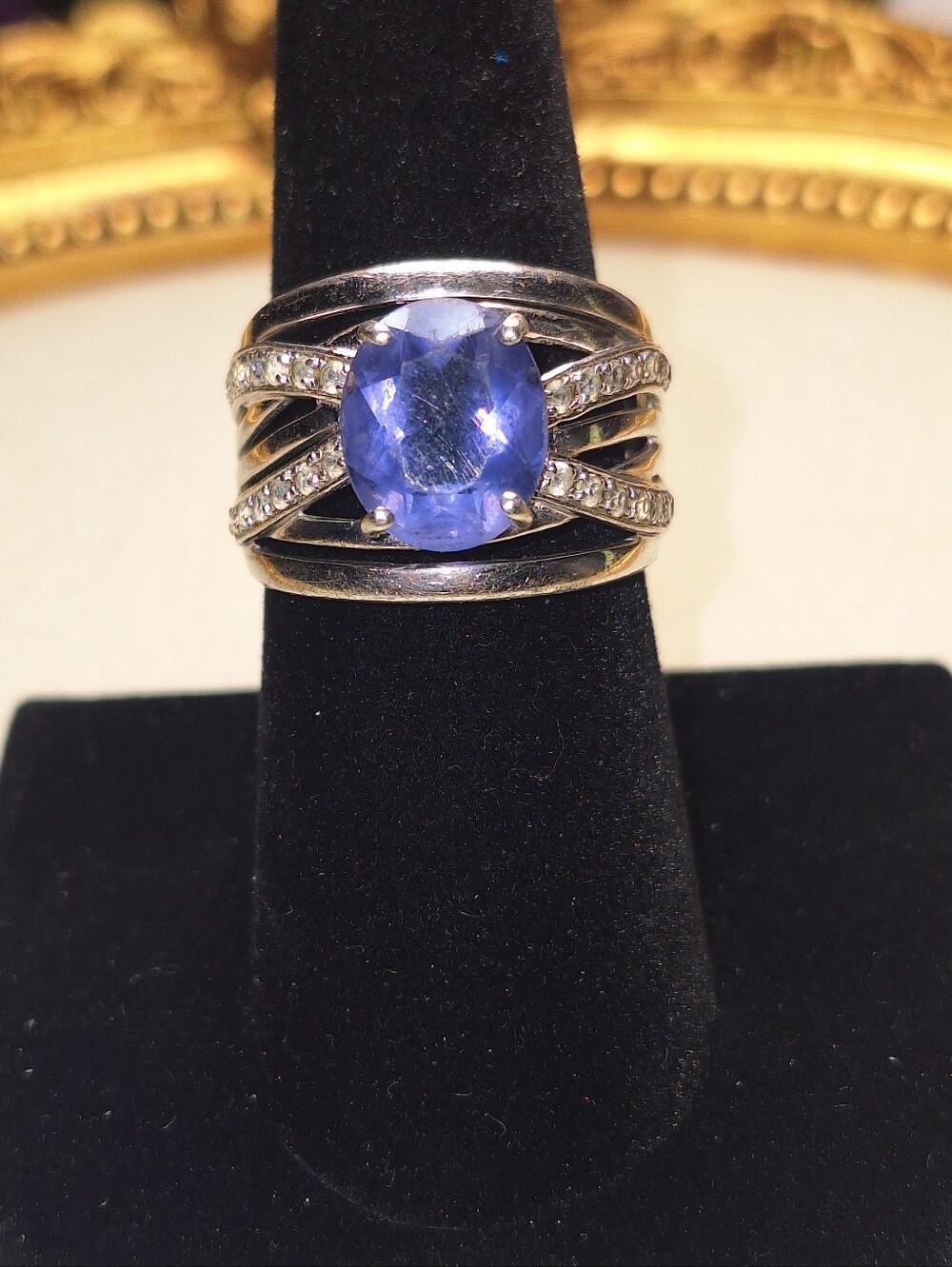 Silver Tone Ring with Blue Oval Gem and Accented Crystals